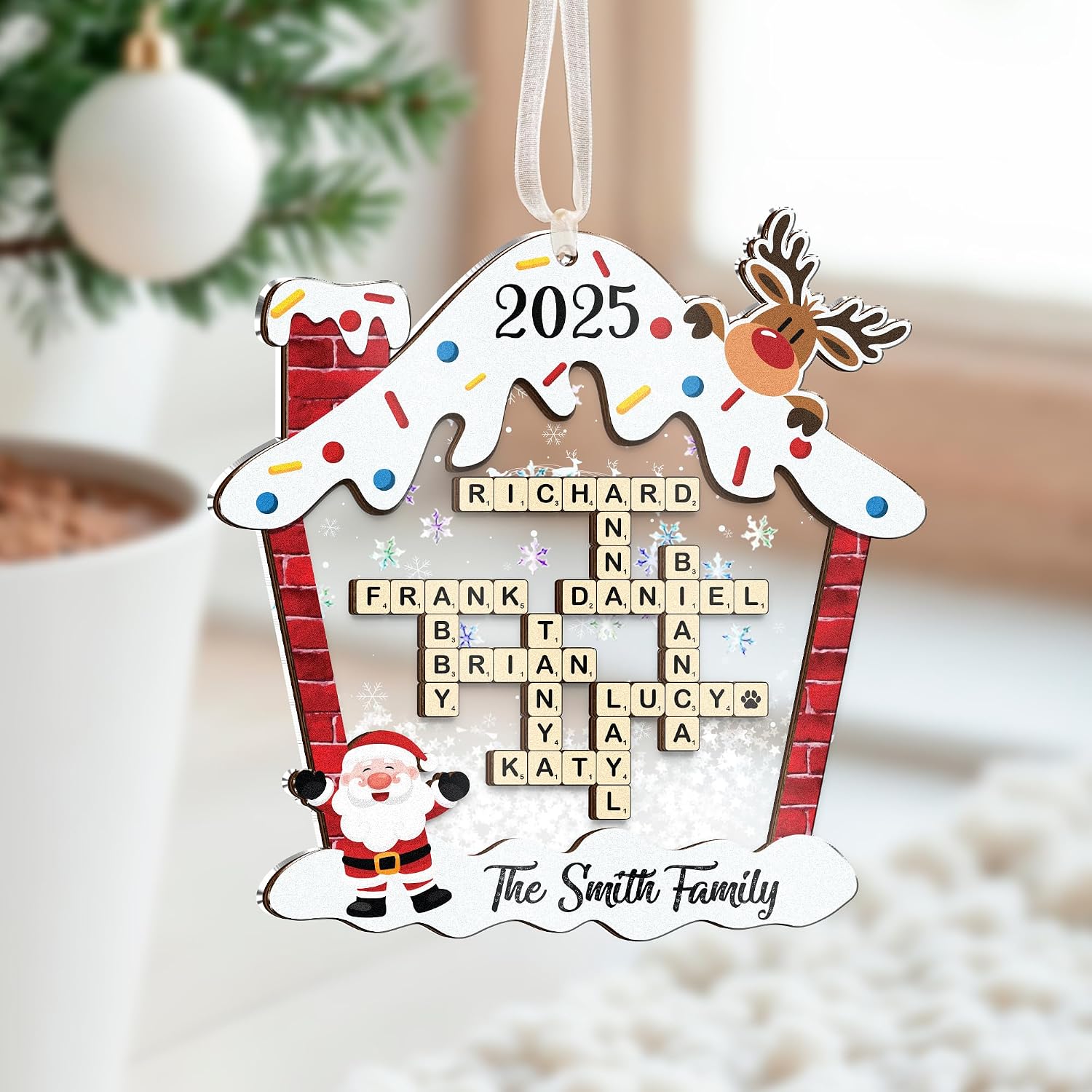 Personalized house-shaped ornament made of wood and acrylic, featuring a wooden name cutout.